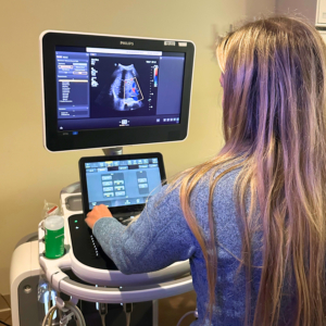 Sonographer Rachel Matz looks at ultrasound image on screen.